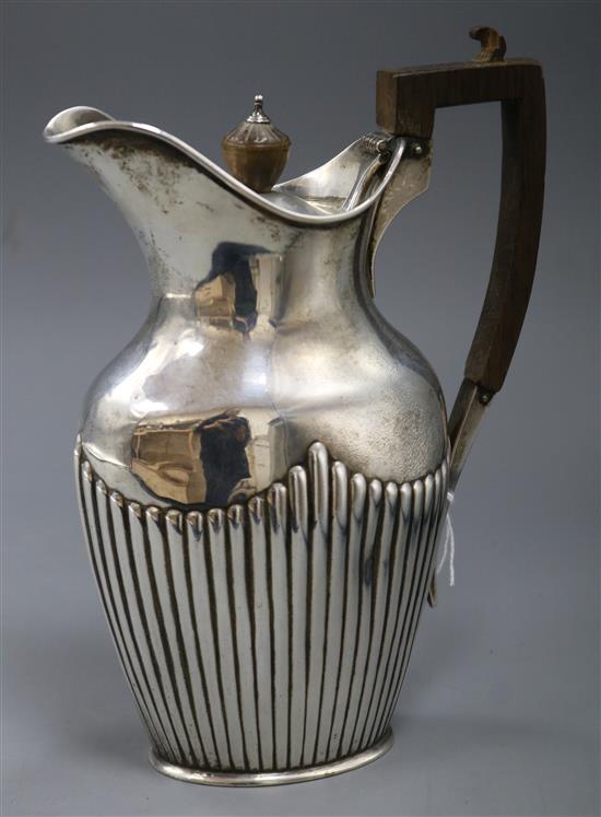 A Victorian demi fluted silver hotwater pot by Waler & John Barnard, London, 1871, 12.5 oz.